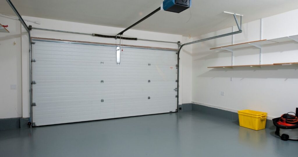Specialist reviewing garage door construction choices for coastal durability and everyday use